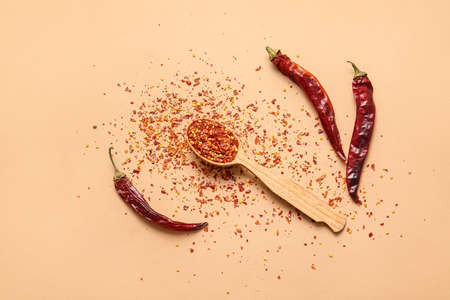 Composition with hot chili pepper on color backgroundの写真素材