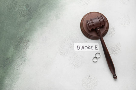 Judge's gavel, rings and paper with word DIVORCE on color backgroundの写真素材