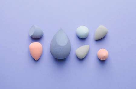 Makeup sponges on color background