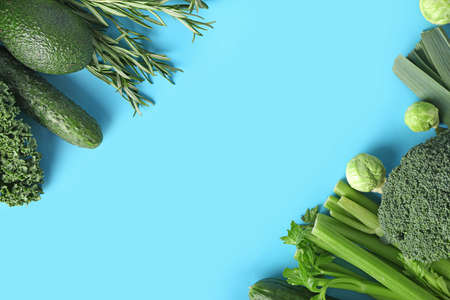 Healthy green vegetables on color backgroundの写真素材