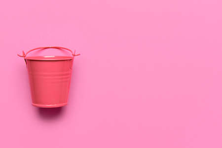 Metal bucket on pink backgroundの写真素材