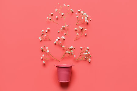 Composition with bucket and flowers on color backgroundの写真素材