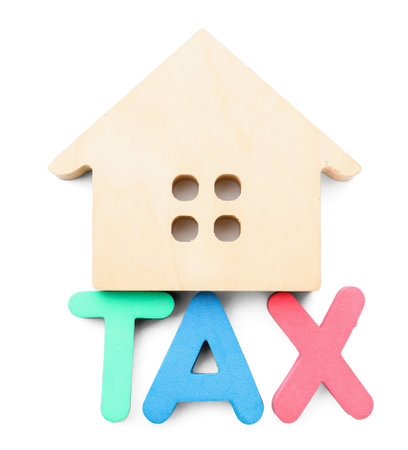 Word TAX with house figure on white backgroundの写真素材