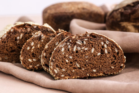 Fresh cut bread on color background, closeup