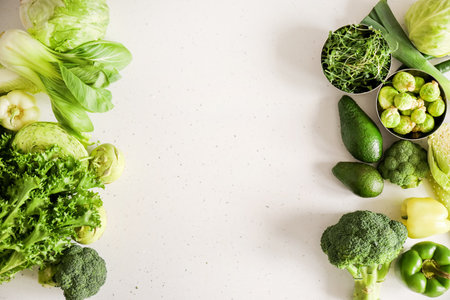 Fresh green vegetables on light backgroundの写真素材
