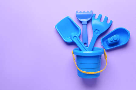 Set of beach toys for children on color backgroundの写真素材