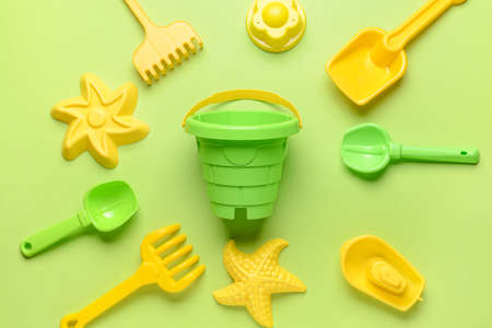 Set of beach toys for children on color backgroundの写真素材