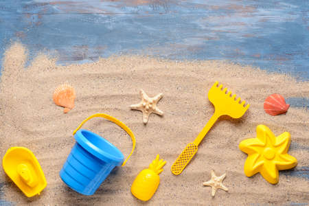 Set of beach toys for children on color wooden backgroundの写真素材