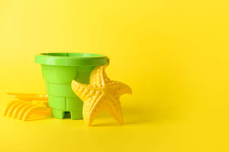 Set of beach toys for children on color backgroundの写真素材