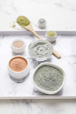 Tray with cosmetic clay on light backgroundの写真素材