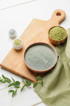 Composition with cosmetic clay on light wooden backgroundの写真素材