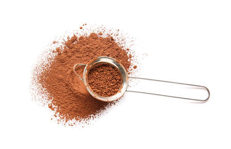 Sieve with cocoa powder on white backgroundの写真素材