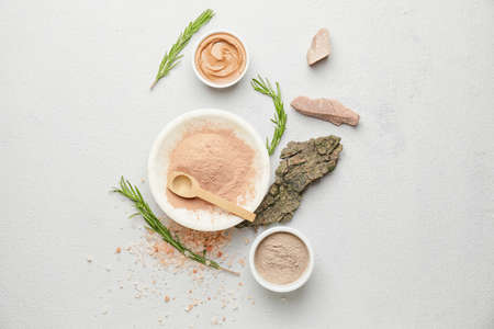 Composition with cosmetic clay on light background