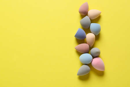 Makeup sponges on color background
