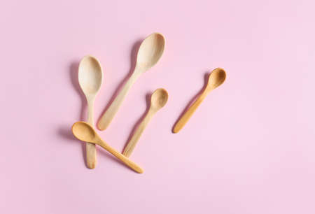 Wooden spoons on color backgroundの写真素材