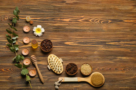 Beautiful spa composition with burning candles on wooden backgroundの写真素材