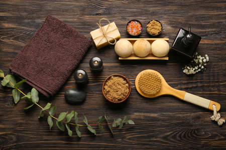 Beautiful spa composition with burning candles on dark wooden backgroundの写真素材