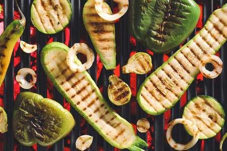Tasty vegetables cooking on grill
