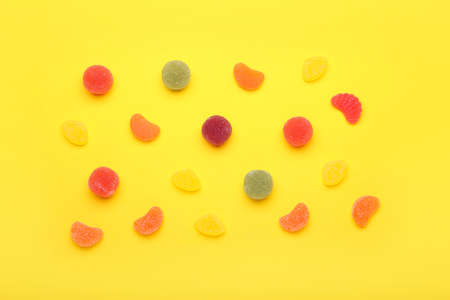 Different jelly candies on color backgroundの写真素材