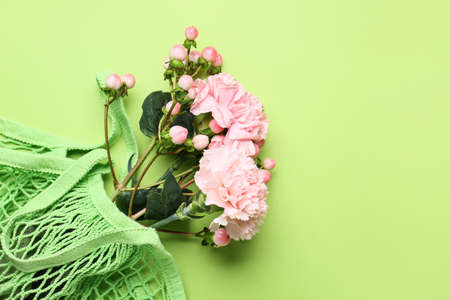 Bouquet of beautiful flowers on color backgroundの写真素材