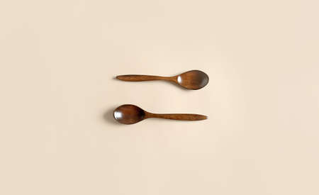 Wooden spoons on color backgroundの写真素材