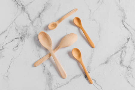 Wooden spoons on light backgroundの写真素材