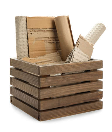 Box with pieces of cardboard on white background