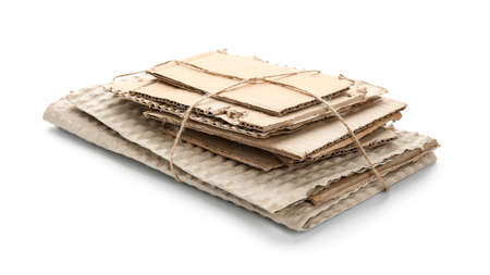 Tied pieces of cardboard on white backgroundの写真素材