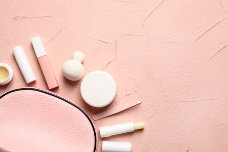 Bag with makeup supplies on color backgroundの写真素材
