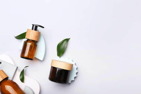 Bottles of cosmetics for hair on white backgroundの写真素材