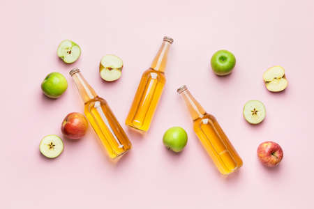 Composition with bottles of apple cider on color backgroundの写真素材