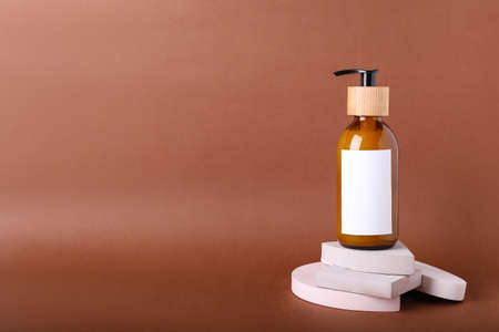 Bottle of shampoo for hair on color backgroundの写真素材