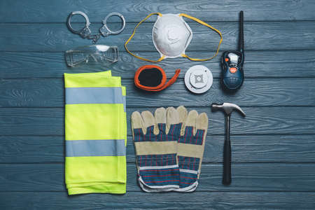 Safety equipment on color wooden backgroundの写真素材