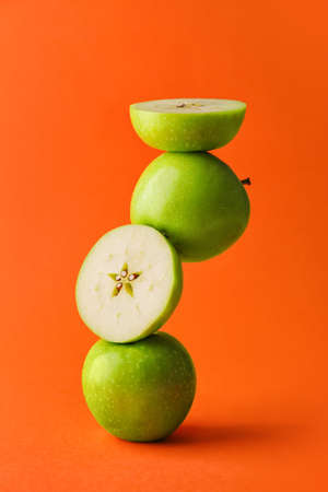 Composition with green apples on color backgroundの写真素材