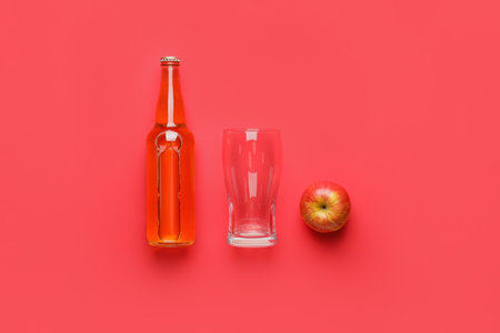 Composition with bottle of apple cider on color backgroundの写真素材