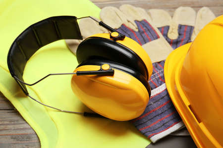 Safety equipment on wooden background, closeupの写真素材