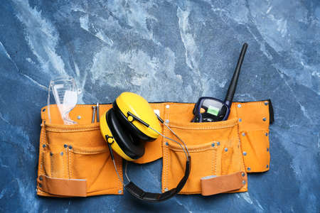 Bag with safety equipment on color backgroundの写真素材