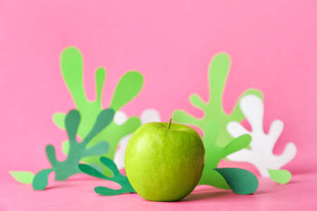 Composition with green apple on color backgroundの写真素材