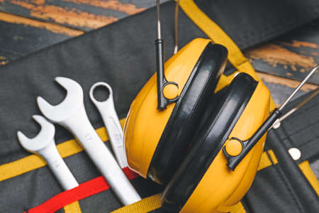 Safety equipment on dark wooden background
