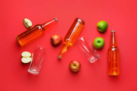 Composition with bottles of apple cider on color backgroundの写真素材