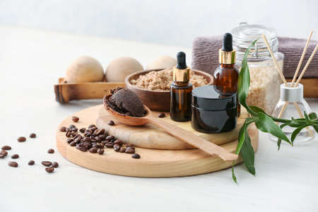 Spa set with coffee scrub on light backgroundの写真素材