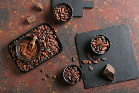 Composition with cocoa beans on grunge backgroundの写真素材
