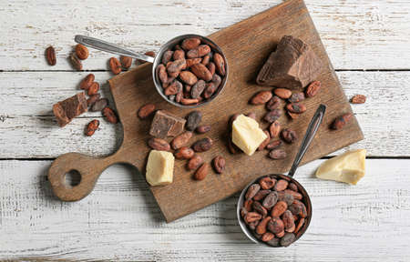 Composition with cocoa products on white wooden backgroundの写真素材