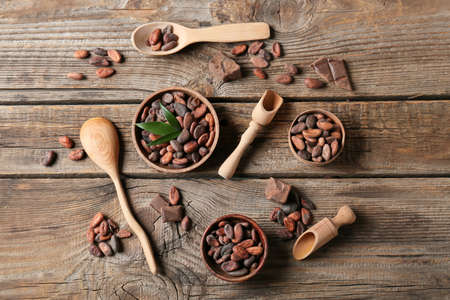 Composition with cocoa beans on wooden backgroundの写真素材