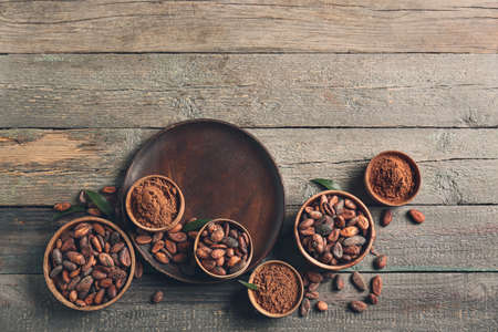 Composition with cocoa beans on wooden backgroundの写真素材