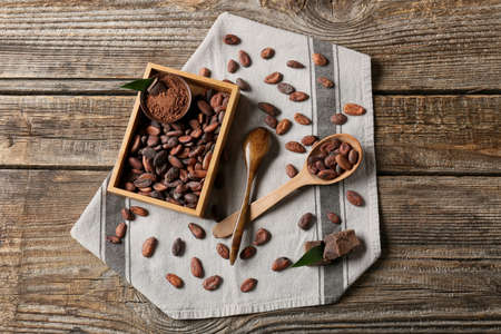 Composition with cocoa beans on wooden backgroundの写真素材