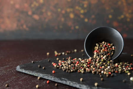 Bowl with peppercorns on dark backgroundの写真素材
