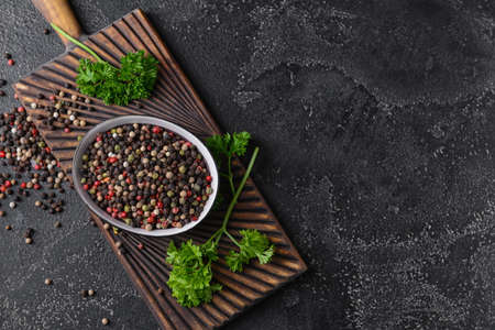 Bowl with peppercorns on dark backgroundの写真素材