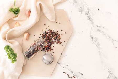 Jar with peppercorns on light backgroundの写真素材