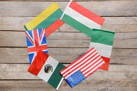 Frame made of different flags on wooden backgroundの写真素材